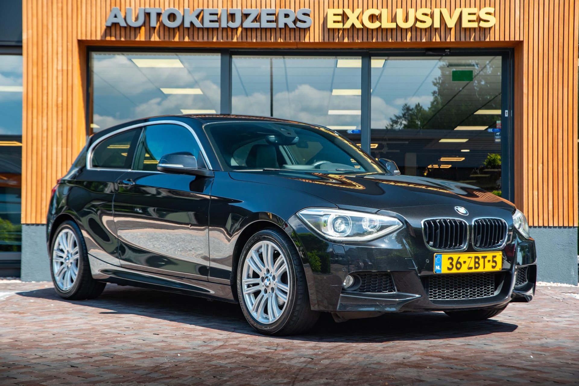 BMW 1-serie 114i 2012 Saphirschwarz metallic 1